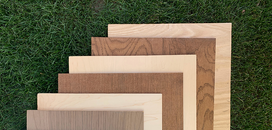 Stacked display of various species of hardwood plywood wood craft panels